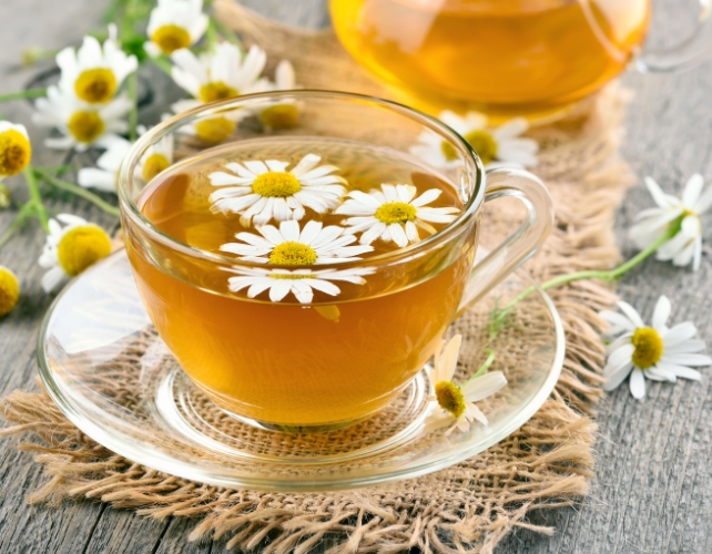 Chamomile tea with flowers on top
