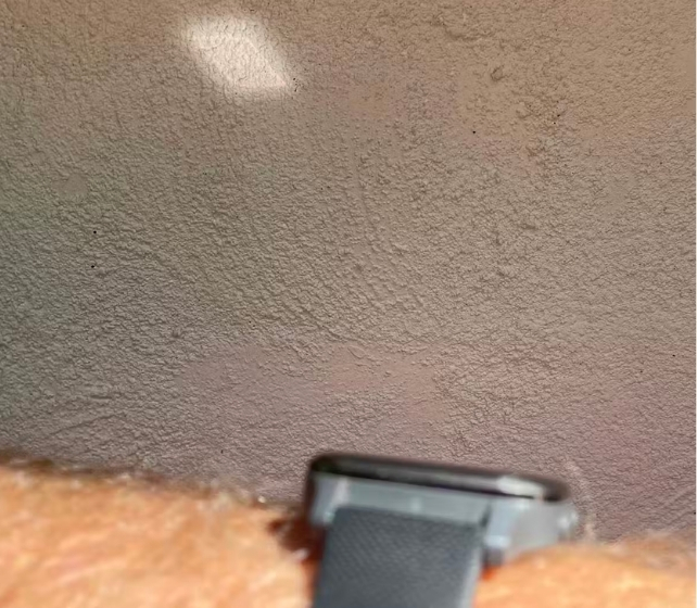 Sunlight bouncing off a watch onto a wall