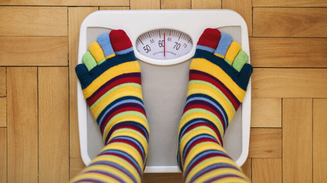 Girl on home weight scales