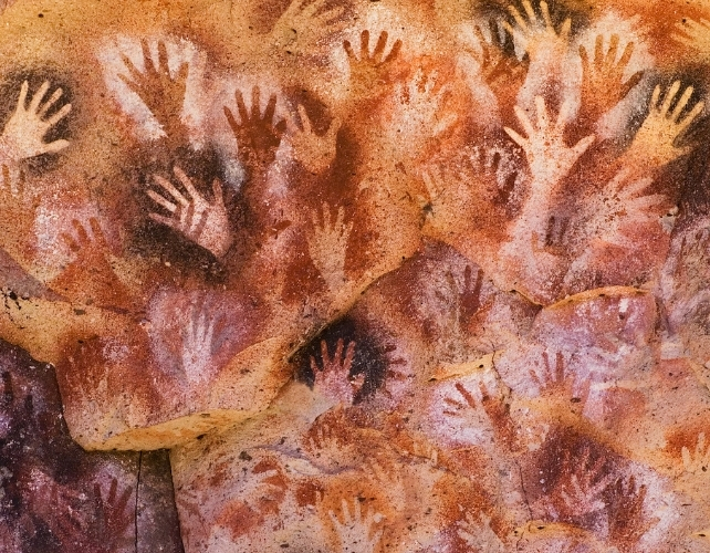 hands painted on a wall
