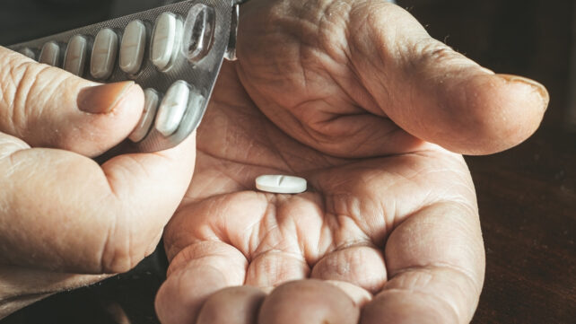 white pill in a hand