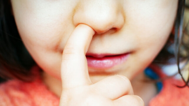 A child picking their nose
