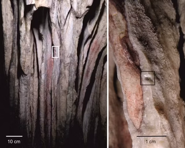 Red pigment washed into the concavities of a cave wall