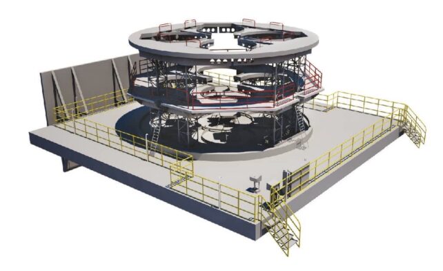A platform with yellow fencing and a huge circular structure
