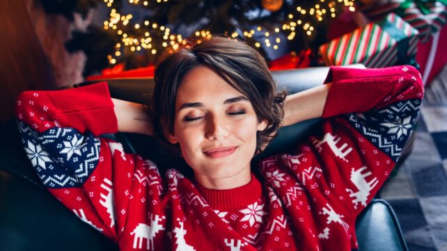 Woman Sleeping By Christmas Tree