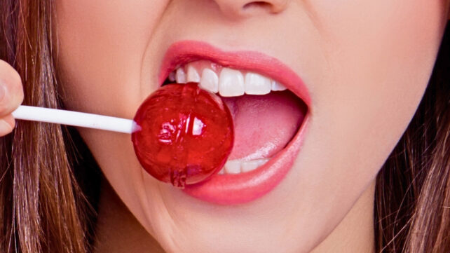 woman eating lollipop