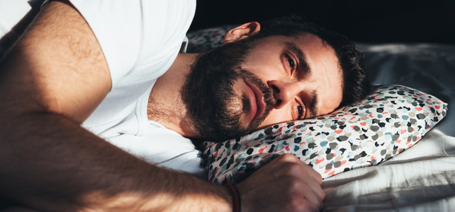 man lying on a pillow