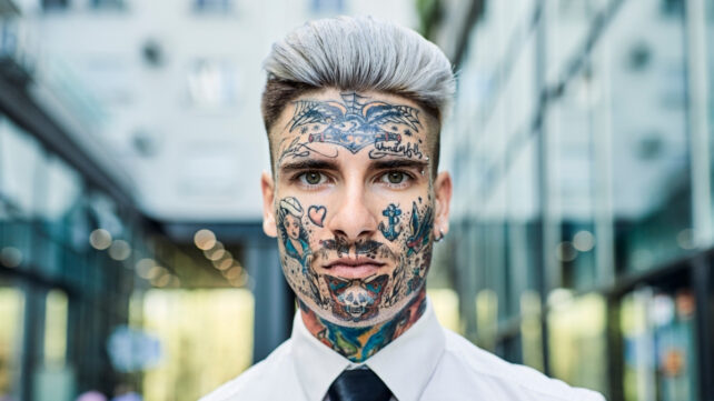 man with face tattoos