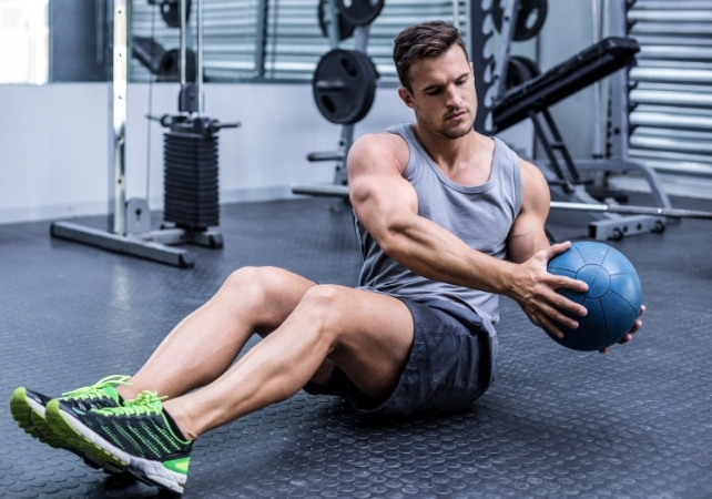 man exercising with a medicine ball