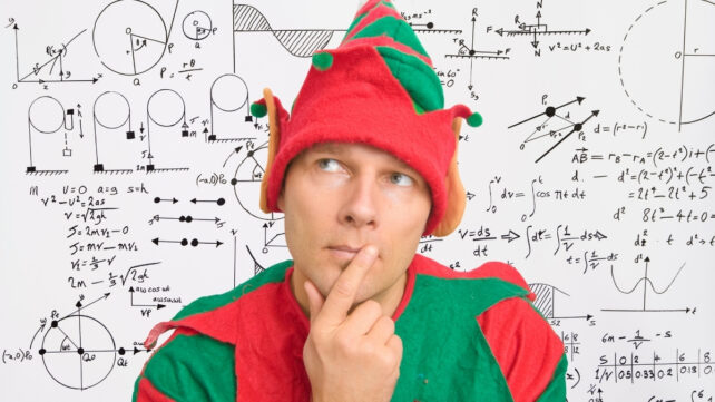 man in an elf costume thinking in front of a white board of mathematics symbols