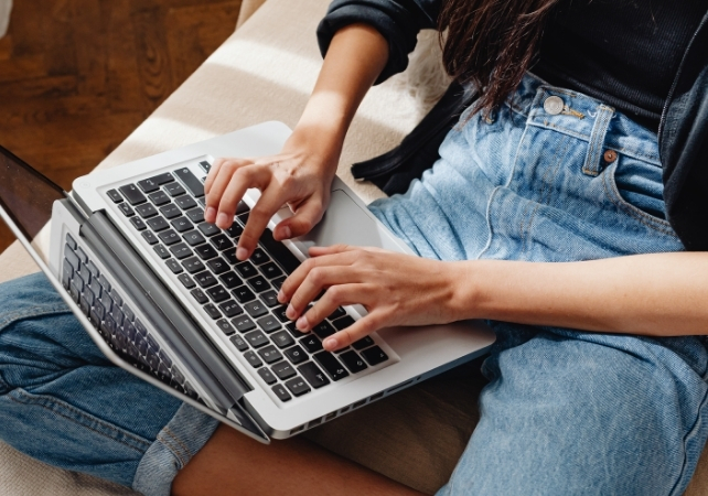 woman typing on a laptop