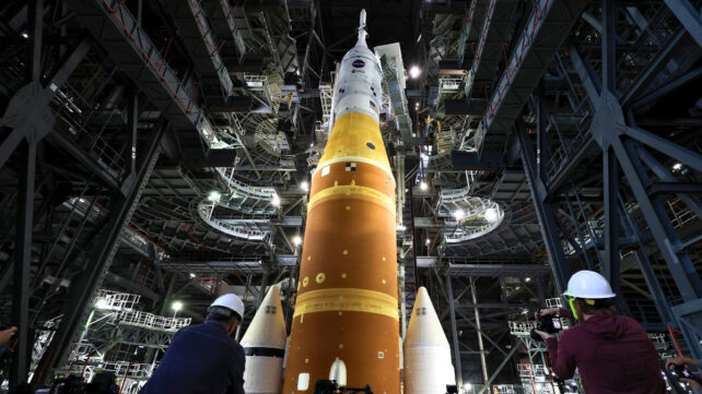 Low angle view of a large rocket inside a building