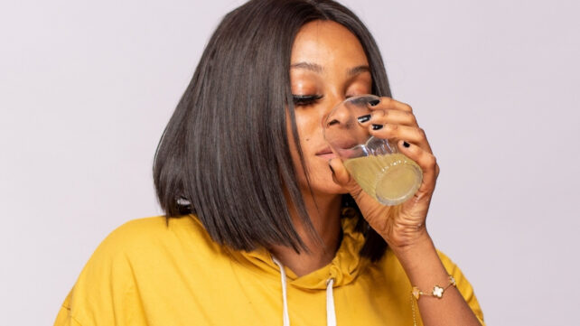 woman drinking laxative