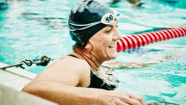 woman smiling in the pool