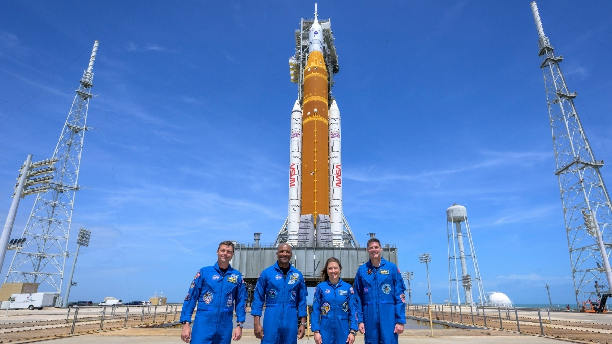 Four NASA astronauts in front of the Artemis 2 mission's rocket Four NASA astronauts in front of the Artemis 2 mission's rocket