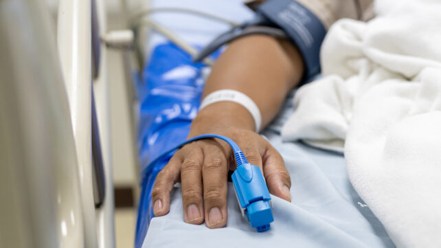 Male patient in a hospital bed