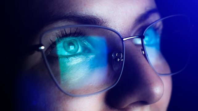 woman looks at computer