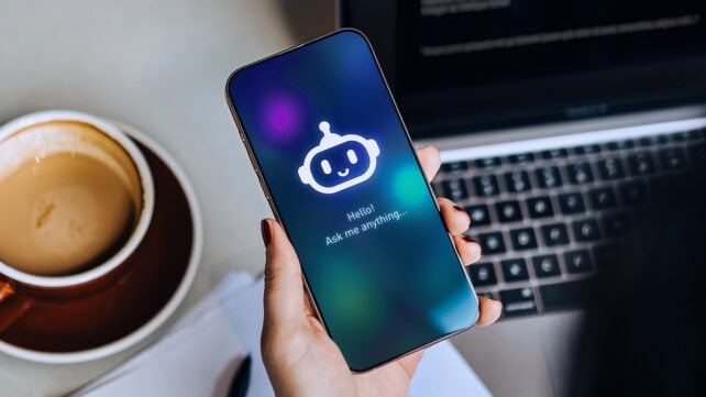 Overhead shot of businesswoman using an AI chatbot