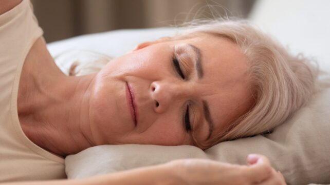 Older woman sleeping, looking calm and serene