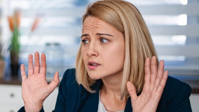Woman looking annoyed or upset at work
