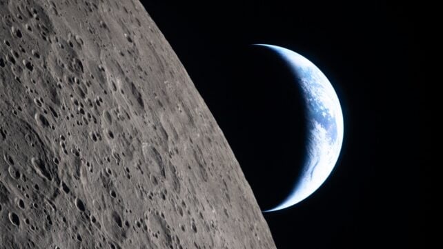crescent Earth setting along the Moon's limb, as seen from the Orion spacecraft on April 6, 2026
