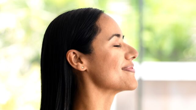 woman breathing inside
