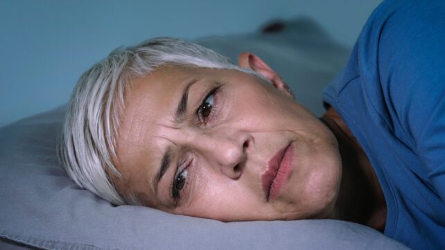 Sleep disorder. Worried senior woman with insomnia.