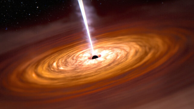 A disk of gas fills the view of this illustration. At the center there is a black dot, which is a black hole, with a thin white line, which is a jet, extending to the top of the image. There are uneven spirals of orange gas that overlap one another from the black dot, extending off the frame. The spirals are whitest toward the center, becoming light orange and progressively darker shades of orange toward the edges of the image. At the top left corner is the surrounding black of space.