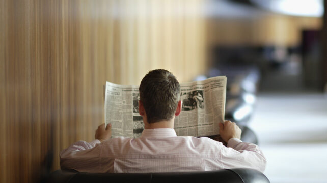 A man reading a newspaper