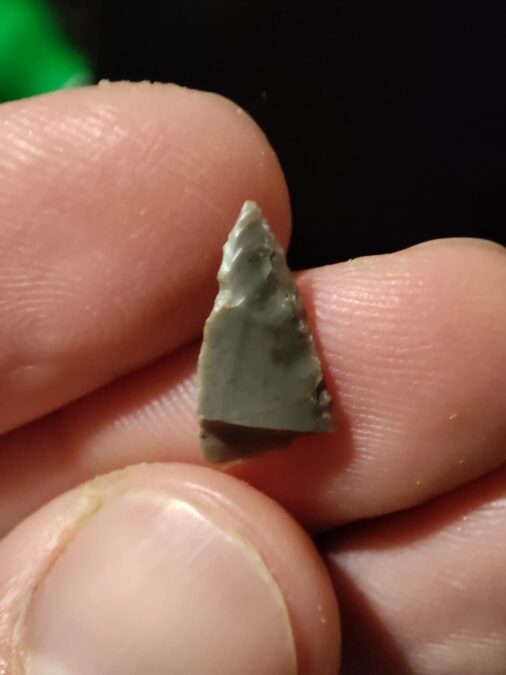 A fragment of a stone point recovered from the Bukov mammoth site.
