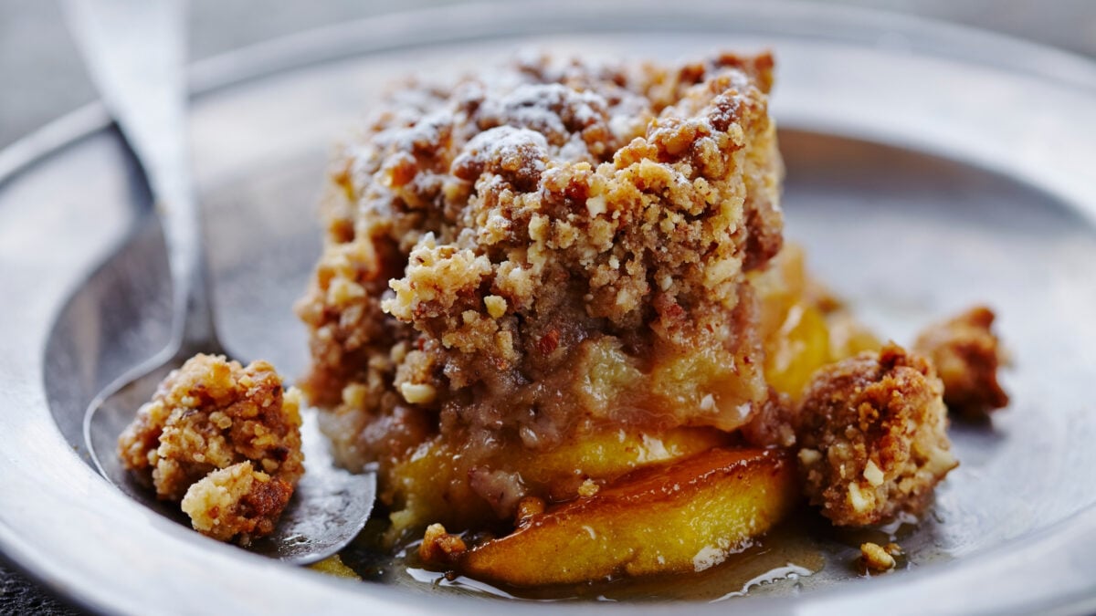 Apple crumble on a plate with spoon