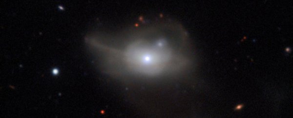 This galaxy is going dark because of a turf war between 2 supermassive black holes