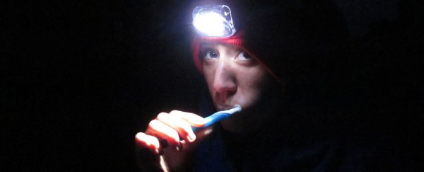 Brushing your teeth in the dark could be the key to a better night’s sleep