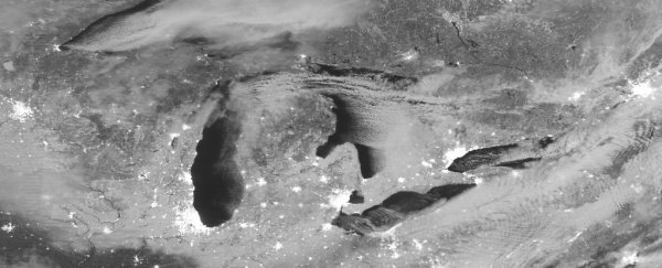This awesome photo shows the snow-covered Midwest moonlit from space