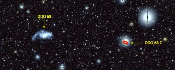 Astronomers just caught a dwarf galaxy giving birth to an even tinier galaxy