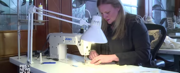 A wedding dress designer has helped engineer a better Ebola suit