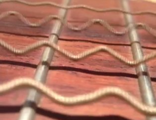 WATCH: What guitar strings are really doing up close