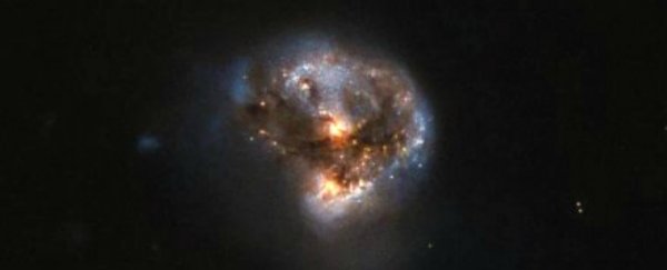 Hubble has photographed a disturbingly beautiful galaxy that acts as a huge laser