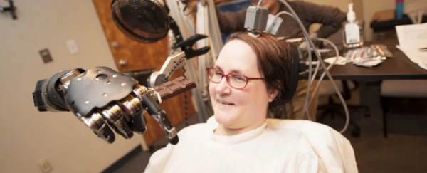 A paralysed woman has flown a fighter jet using only her mind