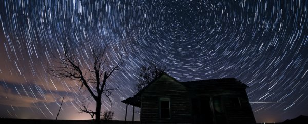A long exposure of ameteor shower above a house