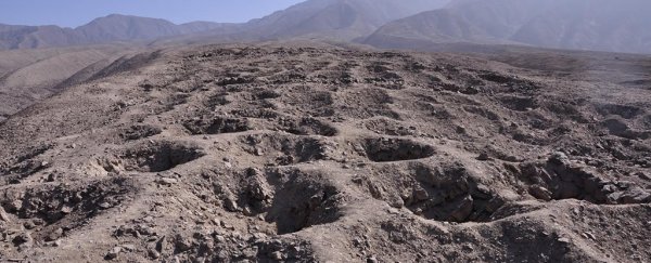 Archaeologists think they've finally solved the mystery of this mile-long 'band of holes'