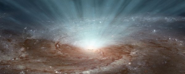 Giant black hole burp could transform an entire galaxy