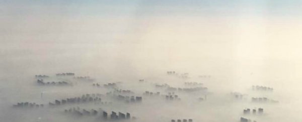 China's smog is so bad right now, you can barely see its skyscrapers from the air