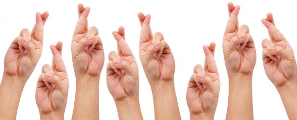 Crossing your fingers can dull physical pain, study finds