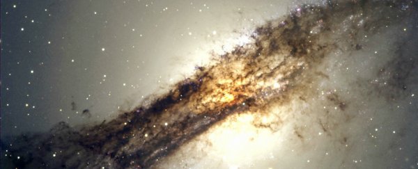 Dark matter and stars 'conspire' to keep elliptical galaxies' spin stable