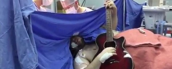 WATCH: Man plays The Beatles on guitar while undergoing brain surgery