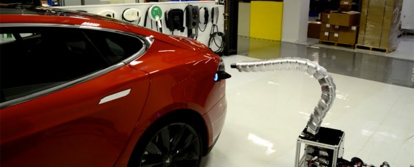 Watch Tesla’s freaky tentacle prototype find its way to a car’s charging port