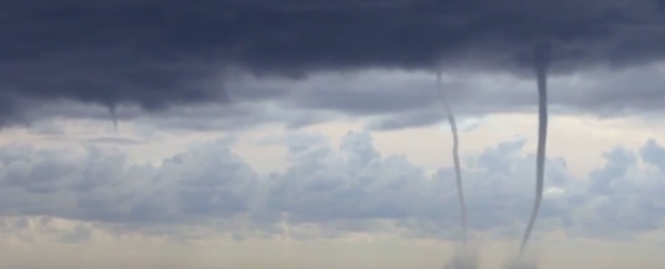 WATCH: Rare footage of waterspouts stretching from clouds to the sea