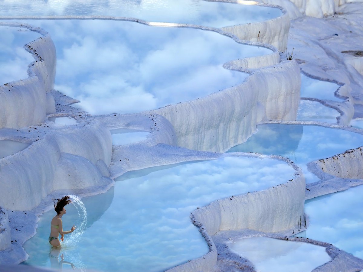 in-the-province-of-denizli-in-western-turkey-the-naturally-terraced-thermal-springs-of-hierapolis-pamukkale-date-as-far-back-as-the-second-century-bc-formed-by-calcite-in-the-water-the-hot-springs-look-like-stunning-white-clouds